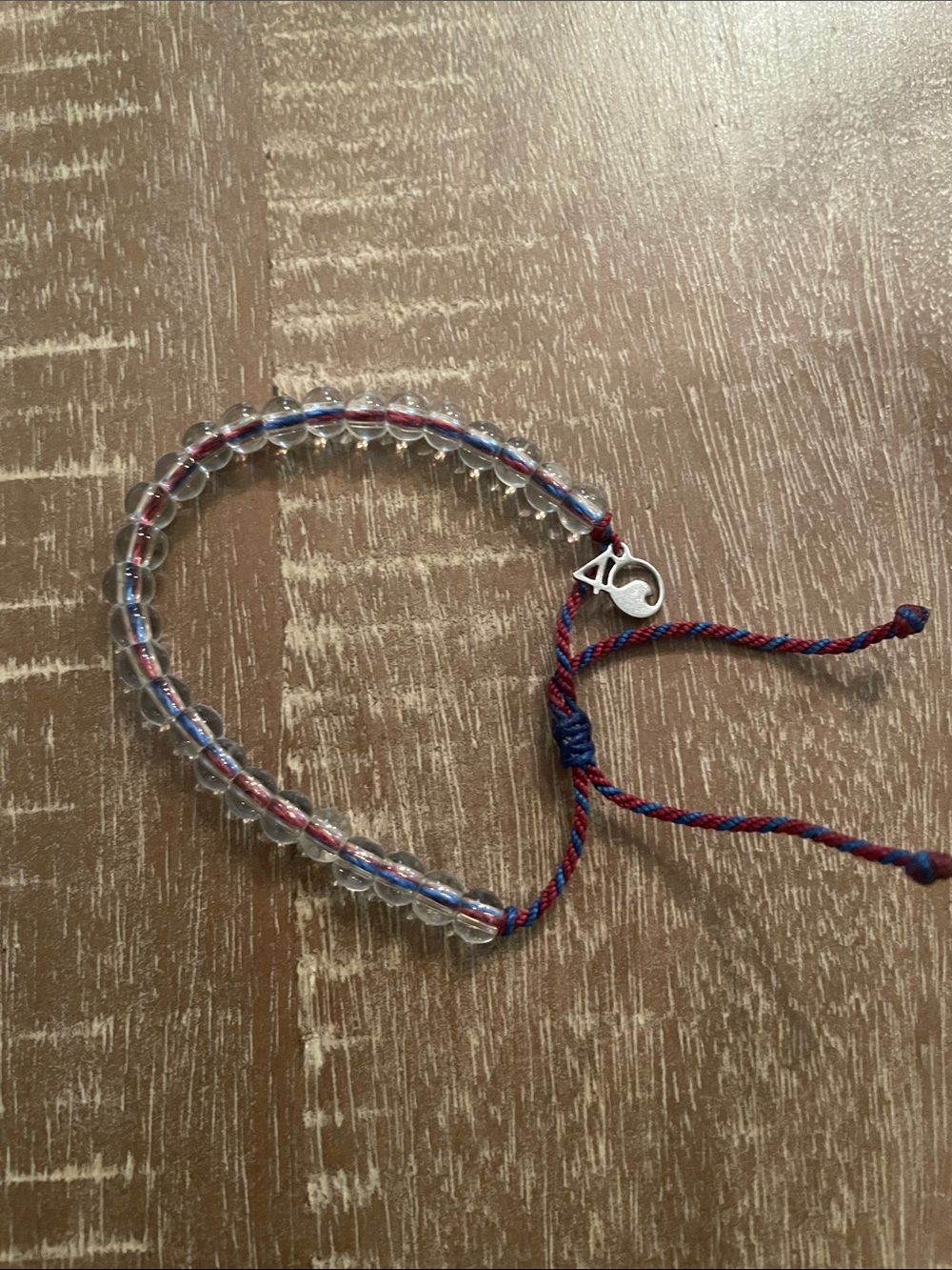 Unisex 4Ocean Clear Beaded Bracelet w/ Red & Blue Thread, Adjustable